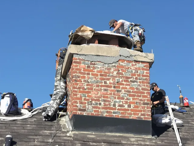Lake Forest Chimney Sweep installing a custom chimney crown in Lake Forest, CA