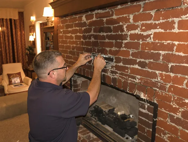 Lake Forest Chimney Sweep expert fixing a fireplace in Lake Forest, CA
